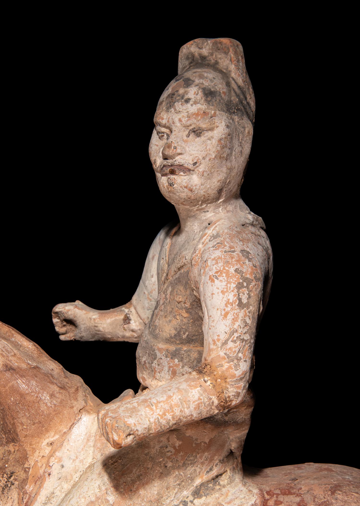 A Pair of Chinese Pottery Equestrian Figures