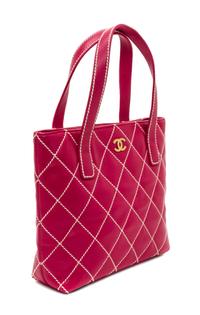 A Chanel Raspberry Caviar Leather Handbag, 12" x 9" x 3".