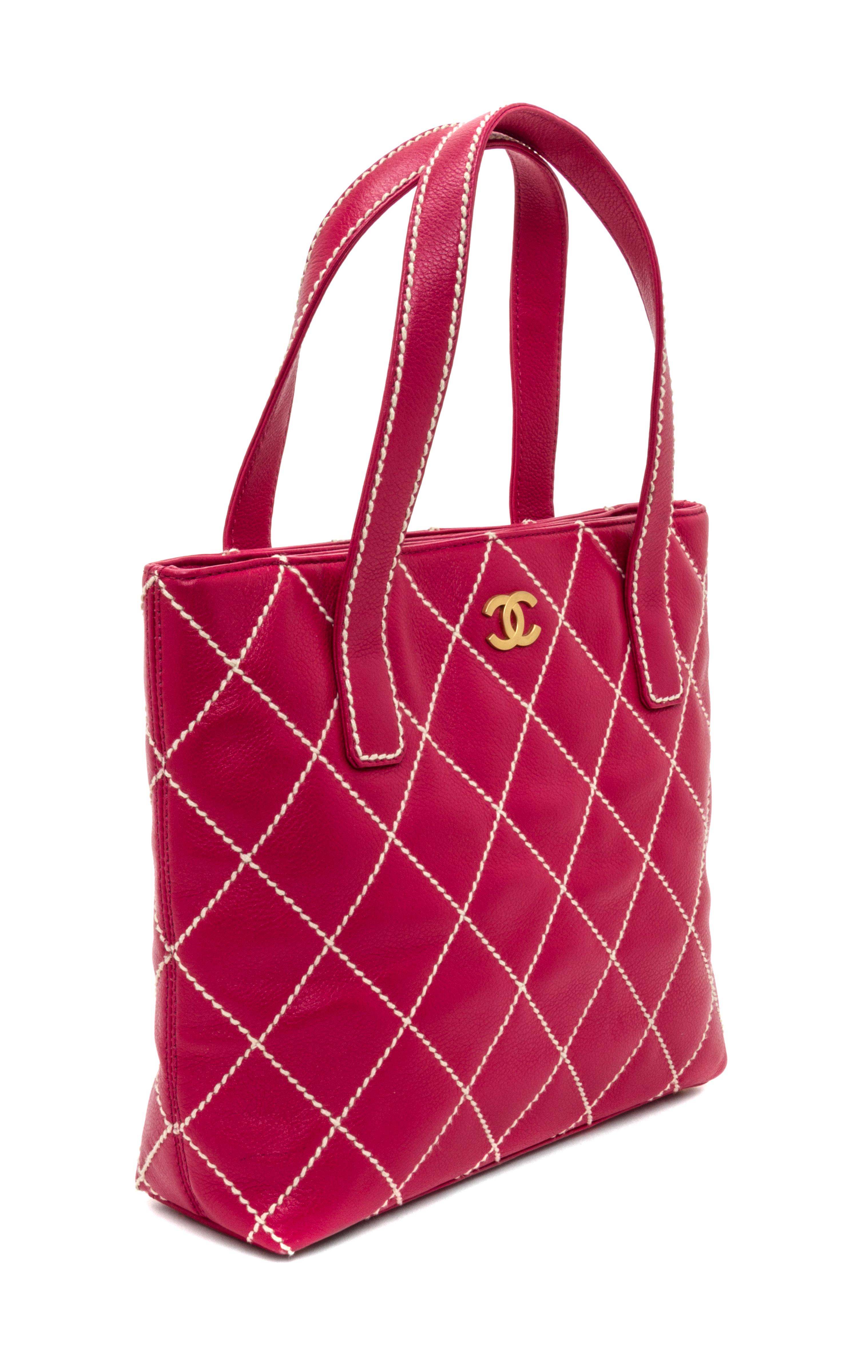 A Chanel Raspberry Caviar Leather Handbag, 12" x 9" x 3".