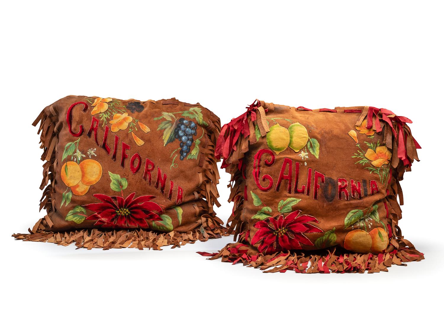 A Pair of California Arts and Crafts Painted and Appliqued Leather Pillows