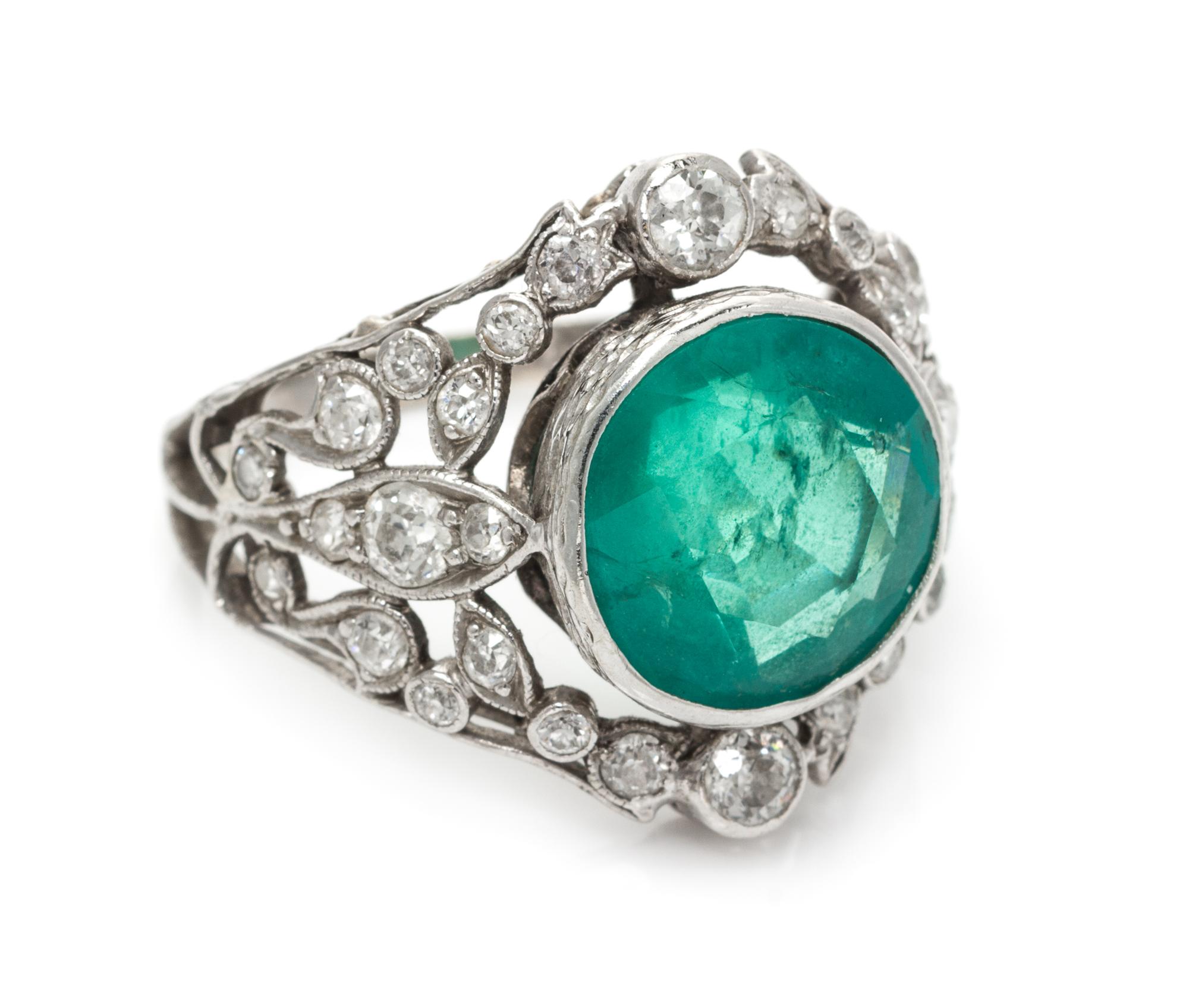 An Edwardian Platinum, Gold, Emerald and Diamond Ring, 4.80 dwts.