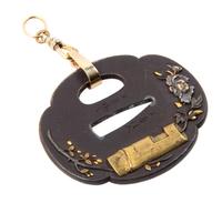 A Japanese Tsuba Length 2 1/2 x width 2 1/4 inches.