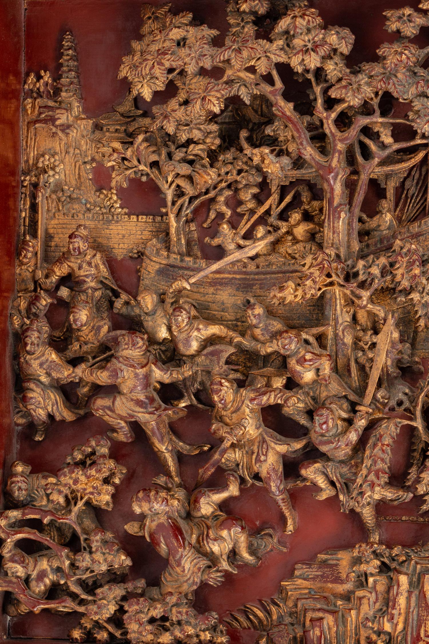 A Large Chinese Pierce-Carved Giltwood Panel Depicting a Battle Scene