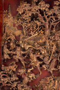 A Large Chinese Pierce-Carved Giltwood Panel Depicting a Battle Scene