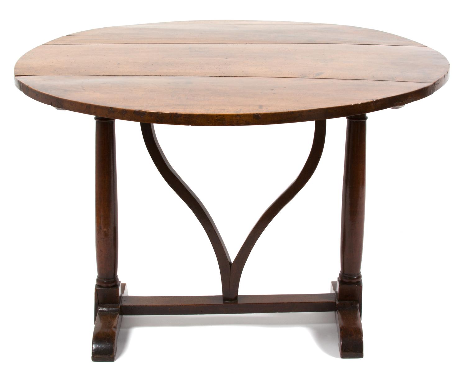 A Continental Provincial Style Walnut Tilt-Top Table Height 28 1/2 x diameter 42 inches. — 19TH CENTURY