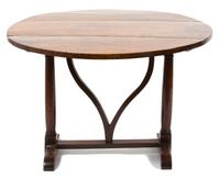 A Continental Provincial Style Walnut Tilt-Top Table Height 28 1/2 x diameter 42 inches. — 19TH CENTURY