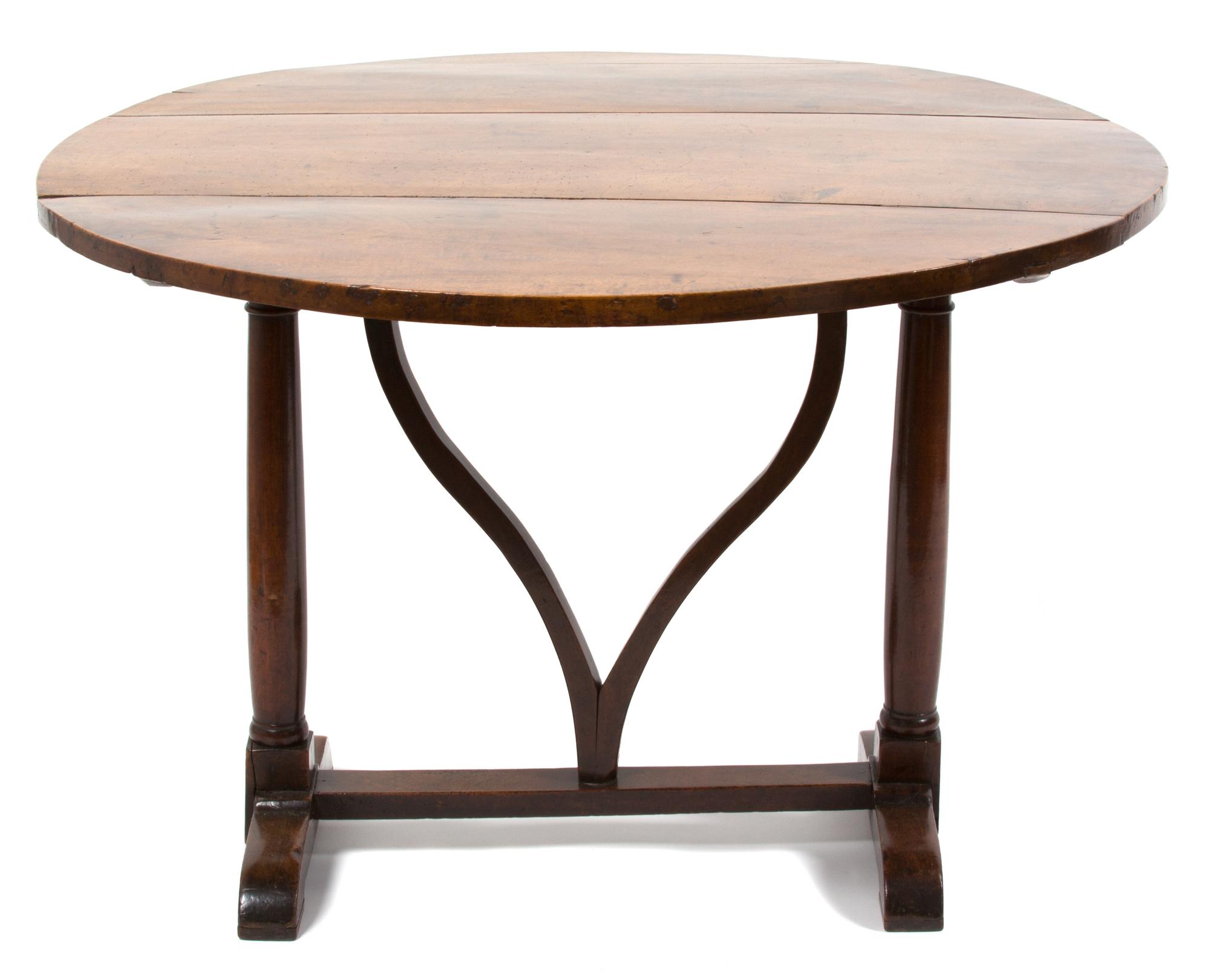 A Continental Provincial Style Walnut Tilt-Top Table Height 28 1/2 x diameter 42 inches. — 19TH CENTURY
