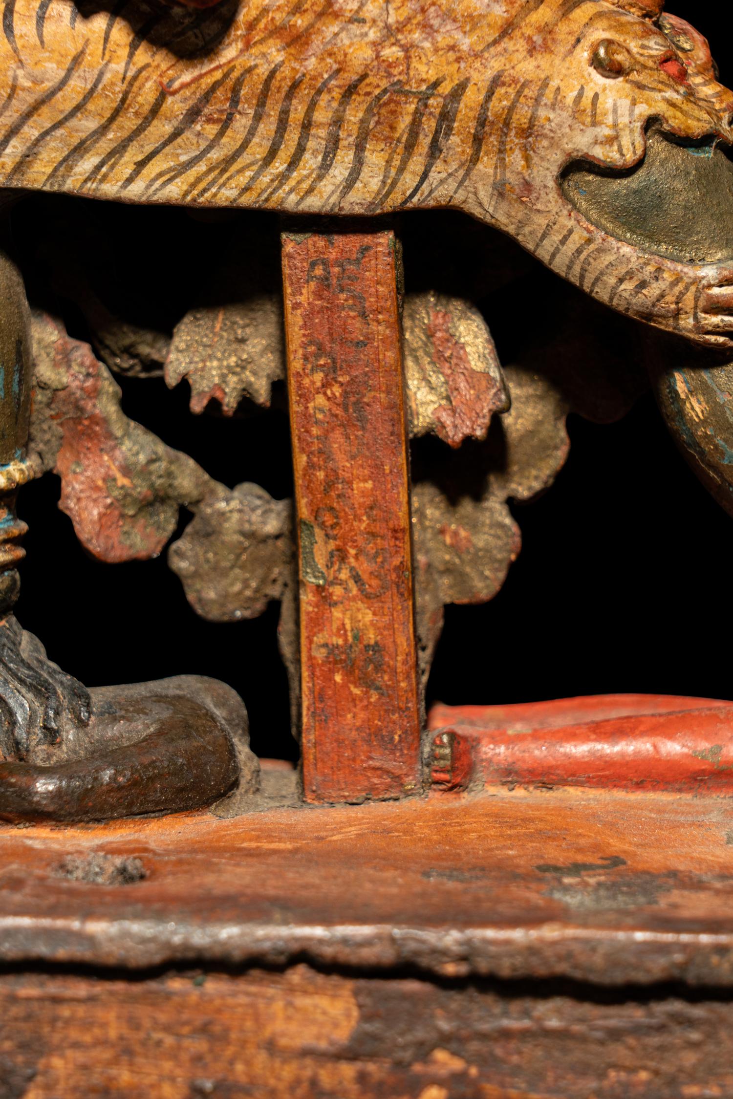 A Tibetan or Bhutanese Polychromed Wood Figure of Chakrasamvara and Consort
