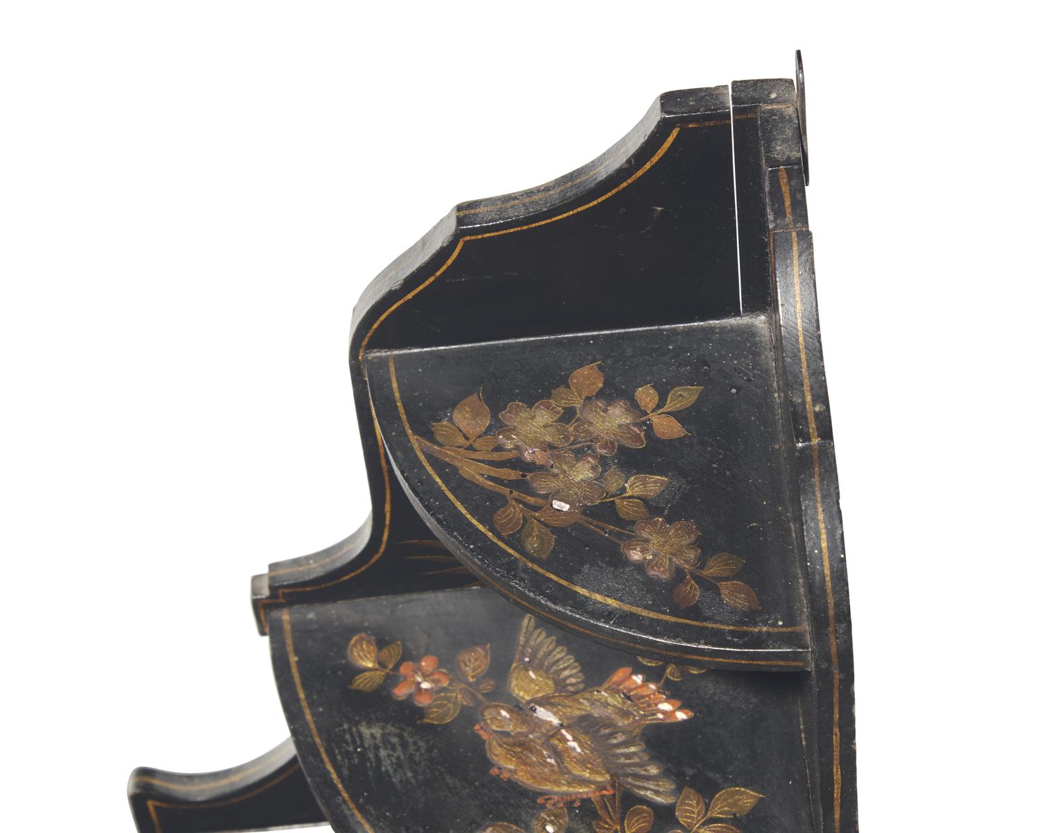 A pair of diminutive Regency style japanned hanging corner cupboards, 19th century