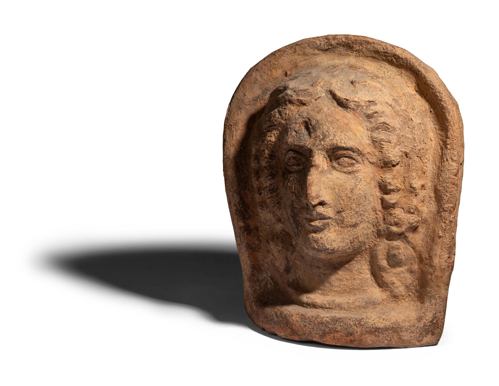 An Etruscan Terracotta Votive Head of a Woman