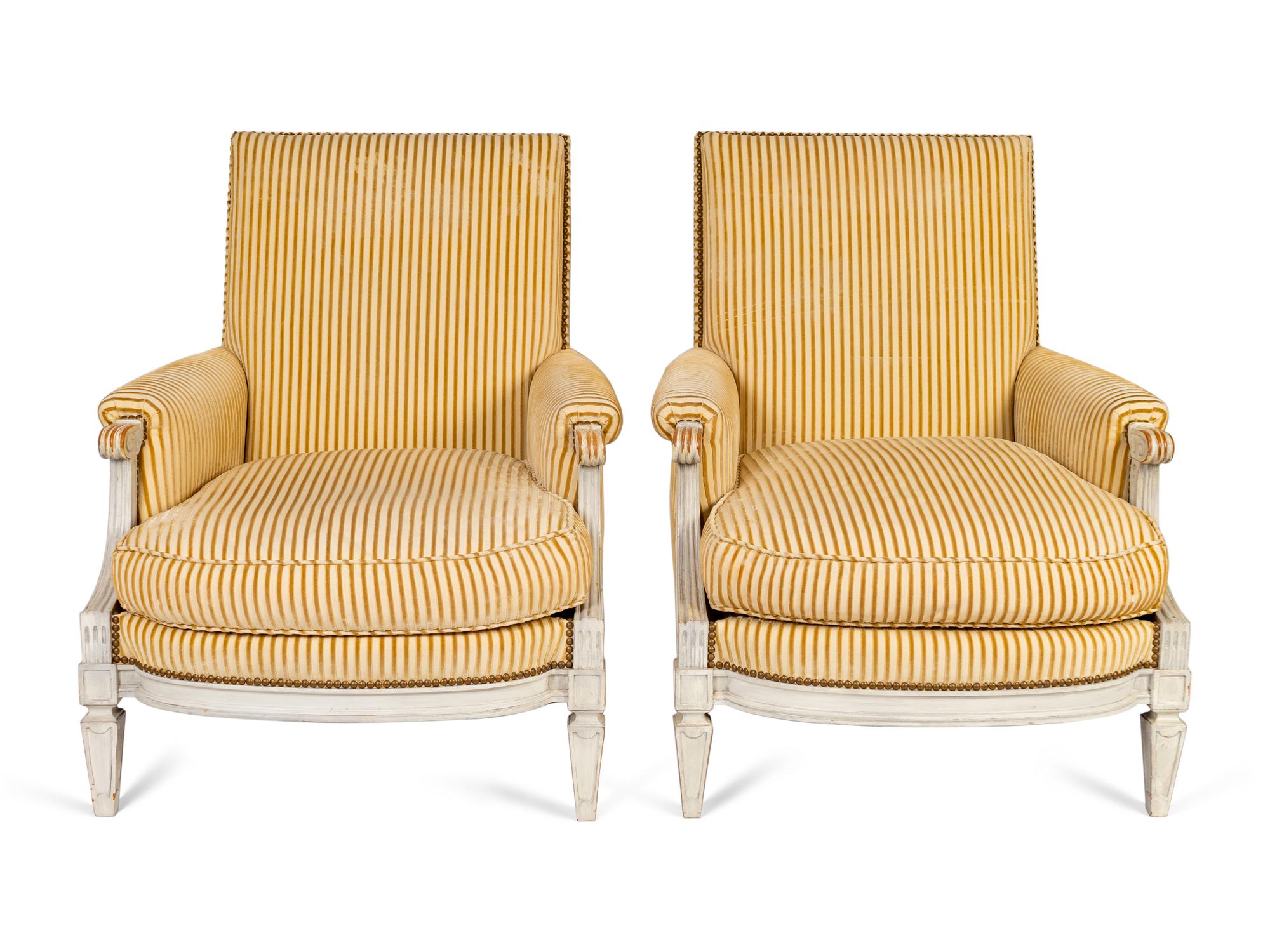 A Pair of Louis XVI Style Carved and Painted Bergeres — 19TH/20TH CENTURY
