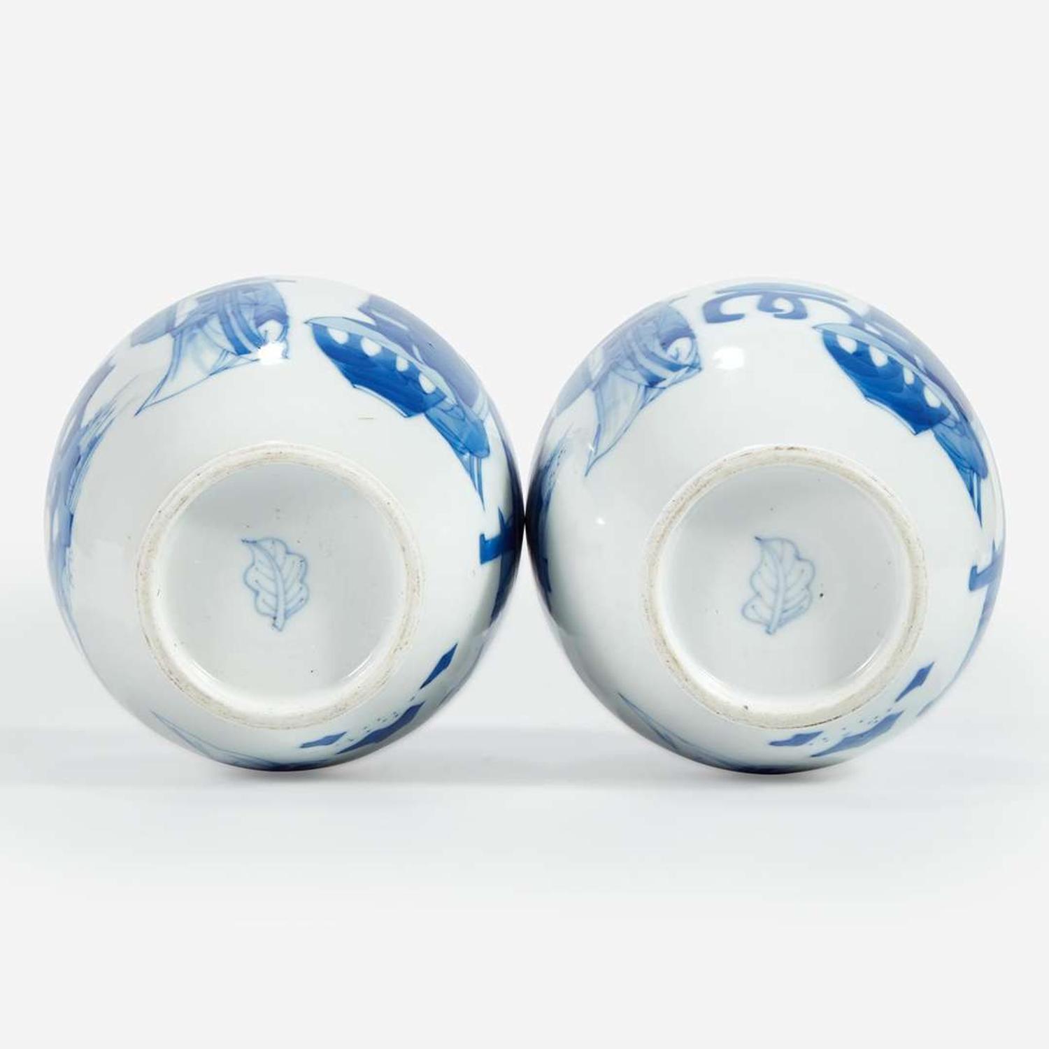 A pair of Chinese blue and white-decorated porcelain small ovoid vases