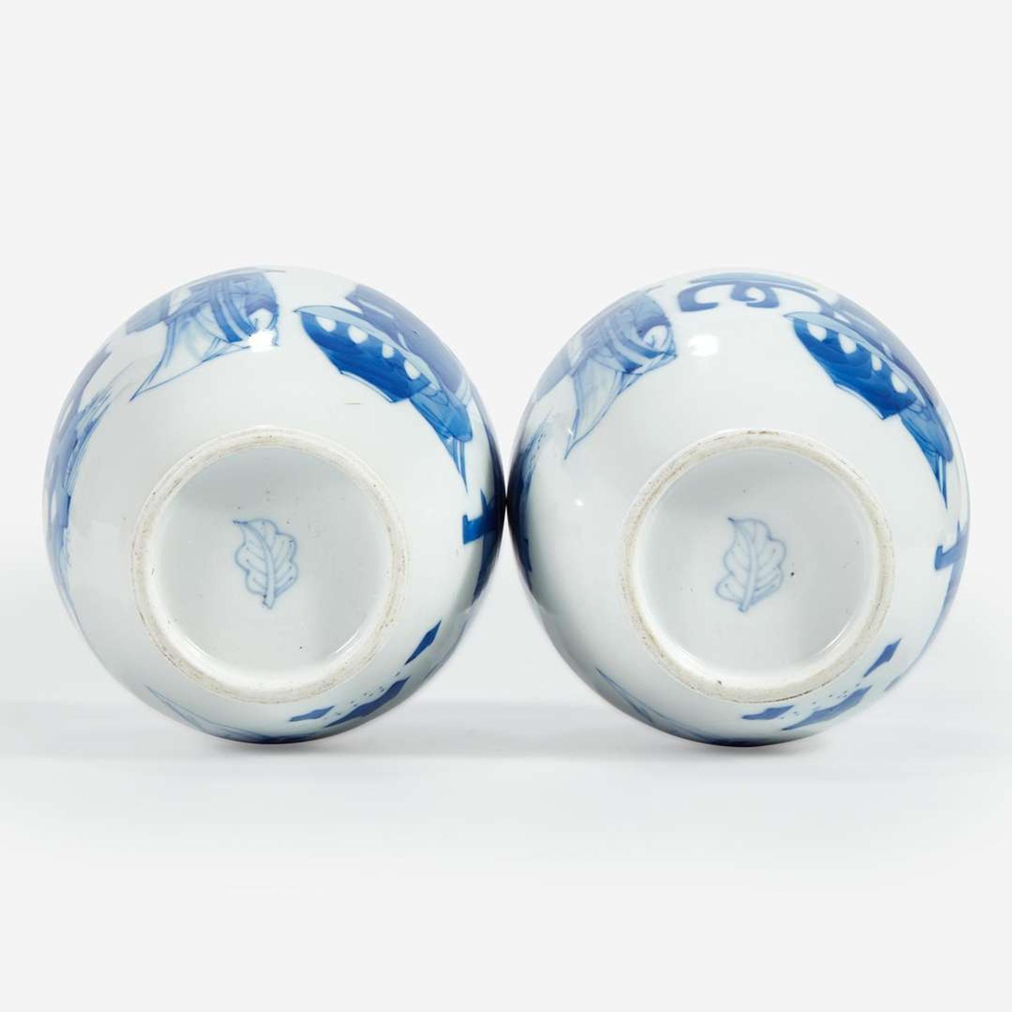 A pair of Chinese blue and white-decorated porcelain small ovoid vases