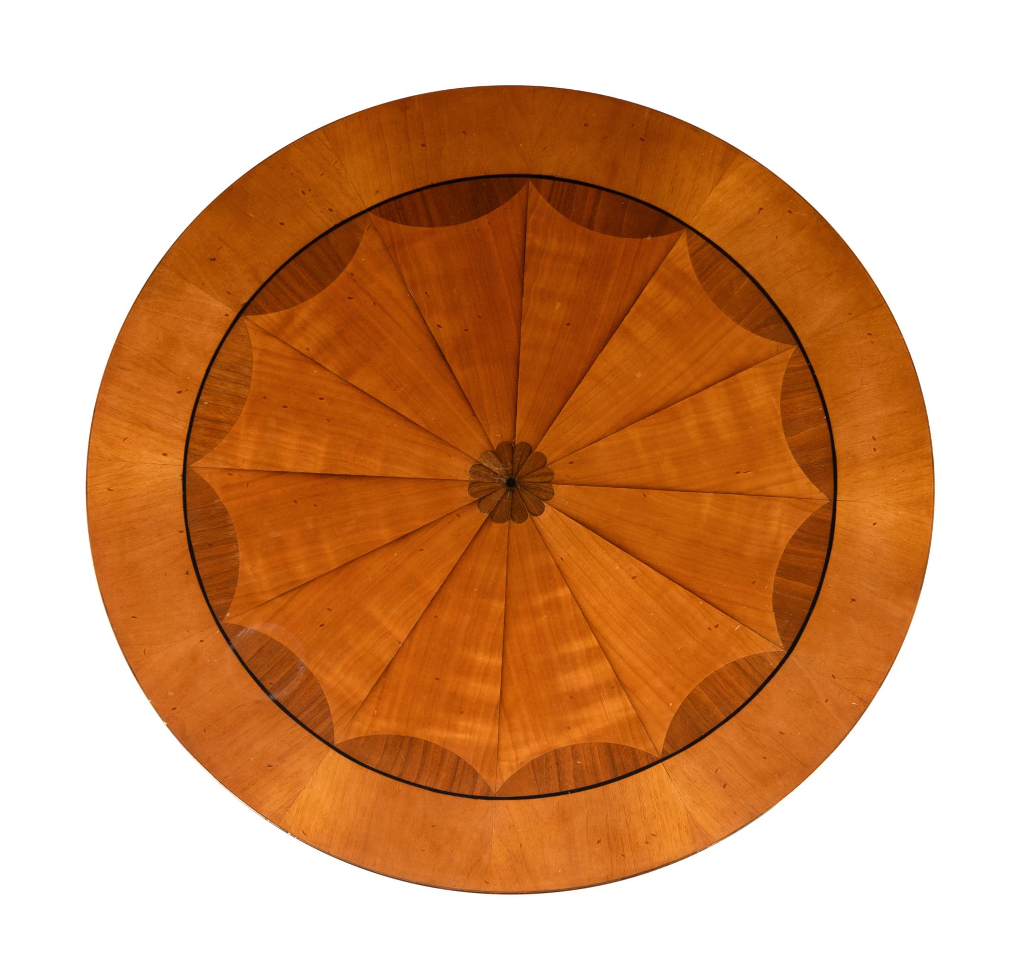 A Biedermeier Style Part-Ebonized Marquetry Center Table