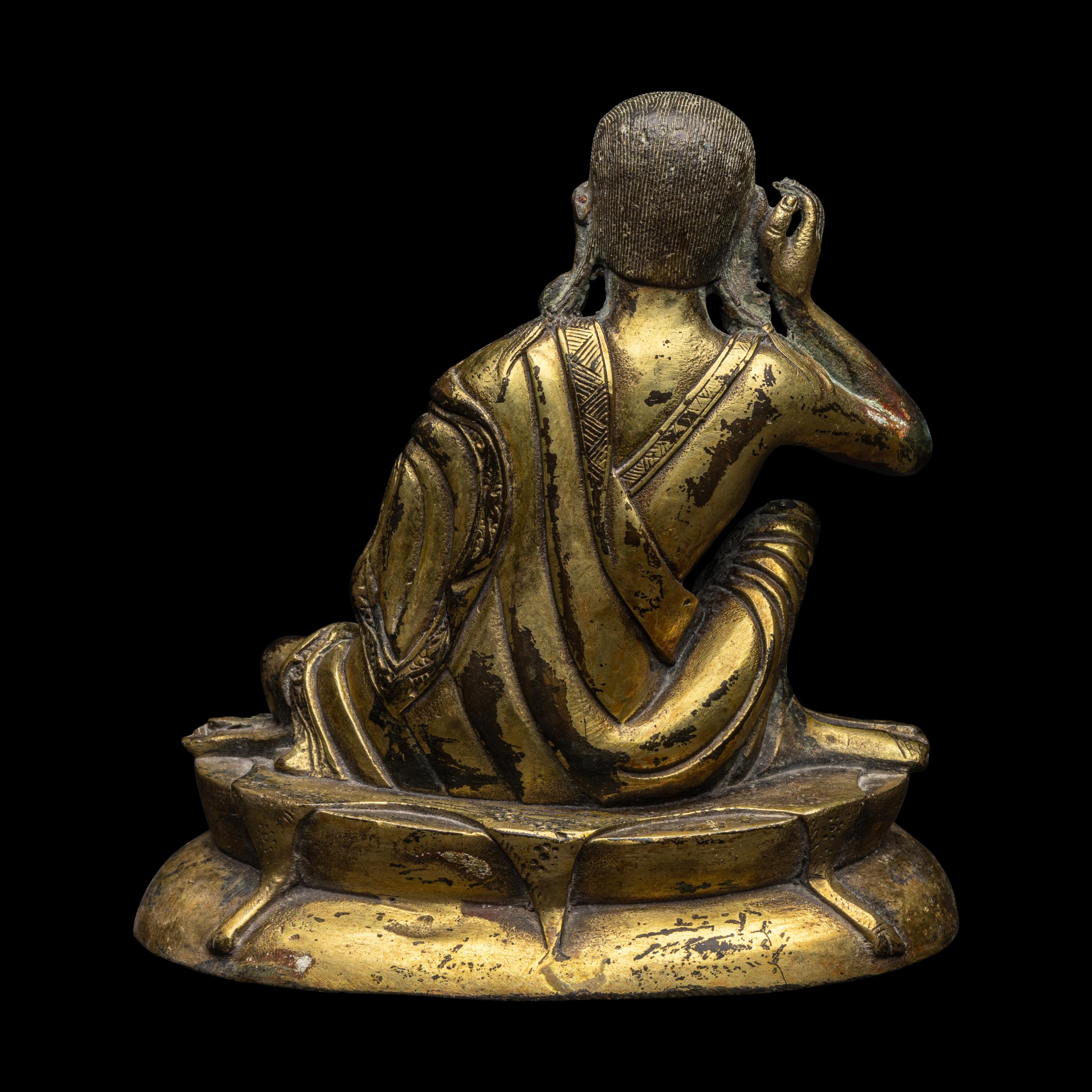 A Sino-Tibetan Gilt Bronze Figure of Milarepa 銅米拉日巴尊者像
