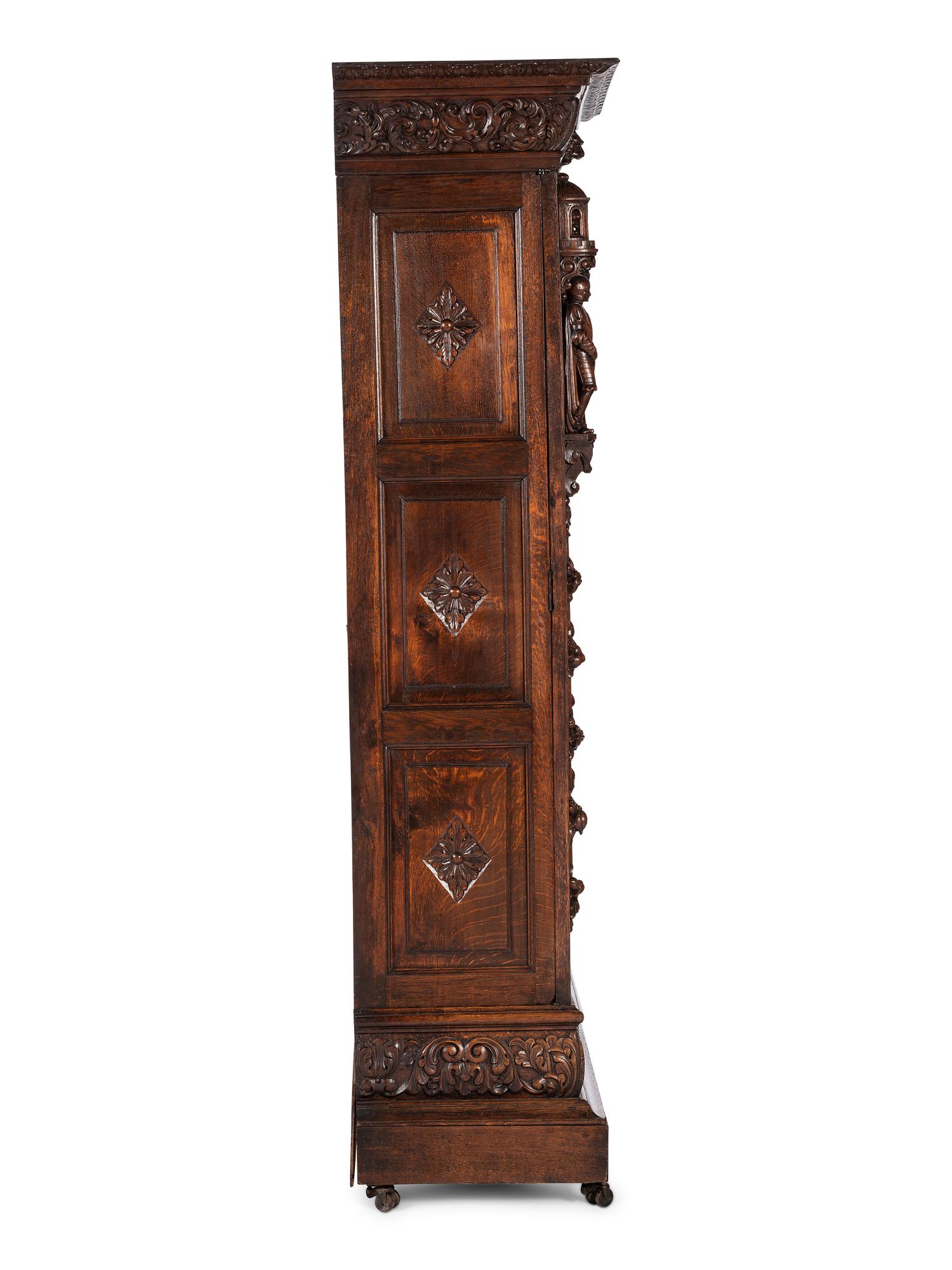 A Renaissance Revival Carved Oak Display Cabinet