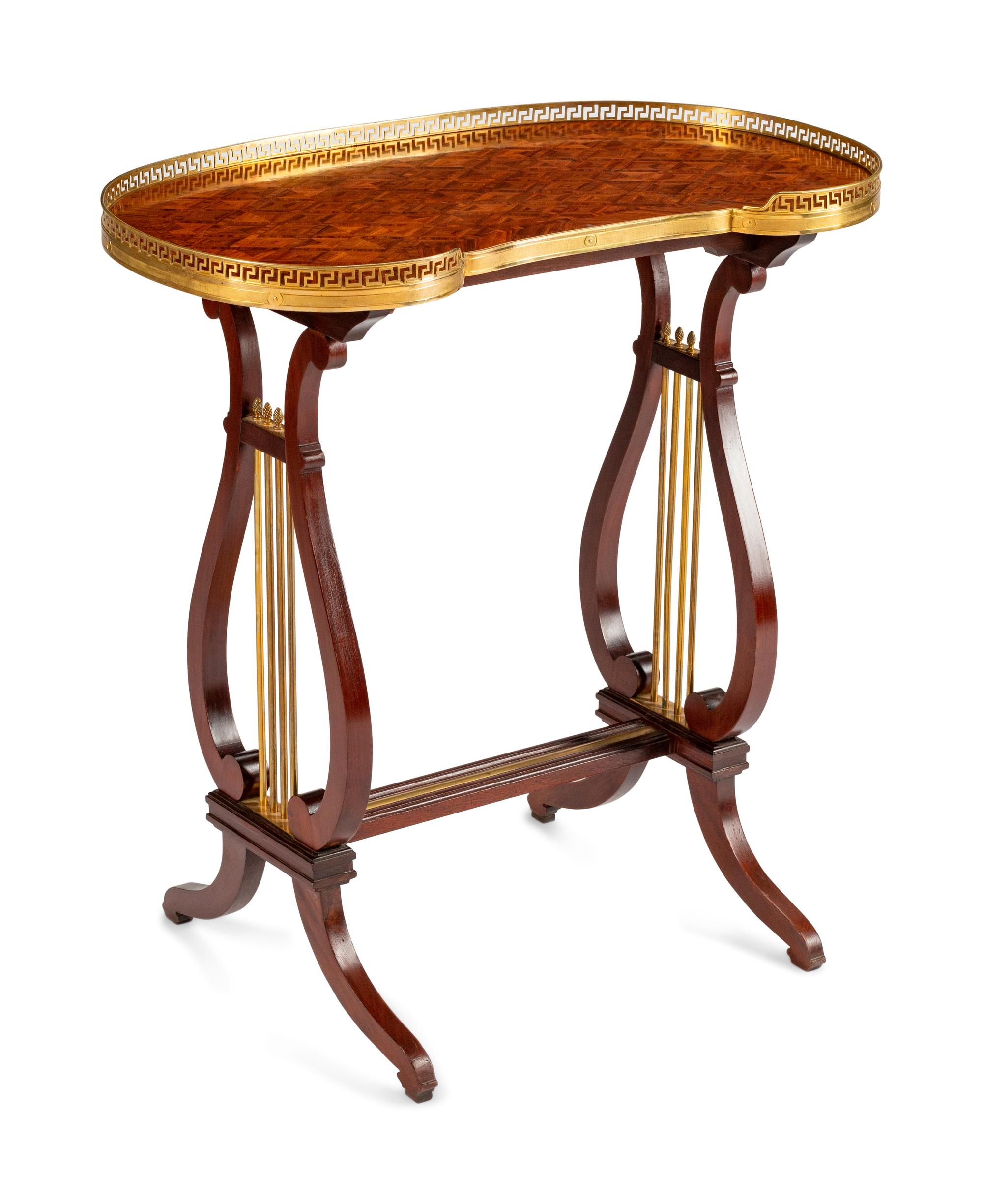 A Louis XVI Style Gilt-Bronze-Mounted Mahogany Kidney-Shaped Table