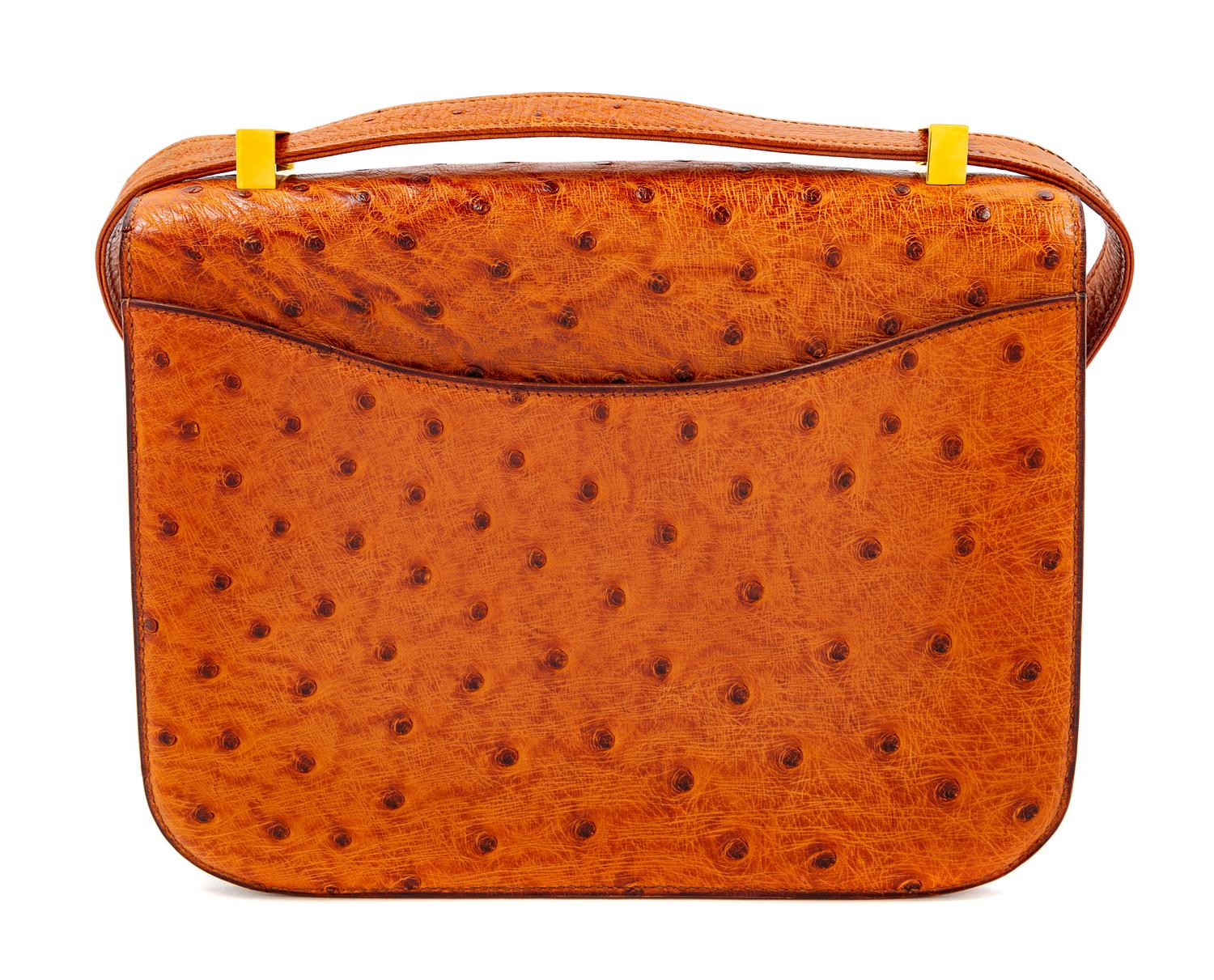 An Hermès Cognac Ostrich Constance Bag, 7" H x 9" W x 2" D; Strap drop: 14" or 8.5".