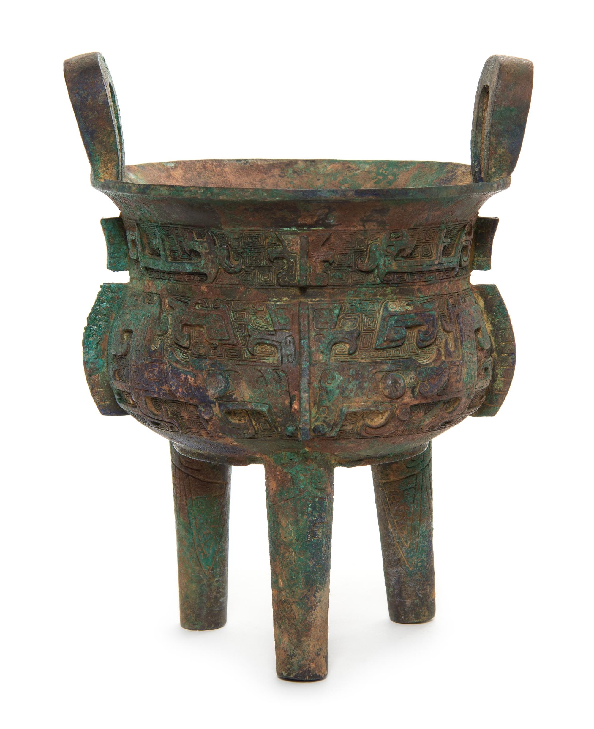 A Bronze Tripod Li Ding Height over handles 11 inches.