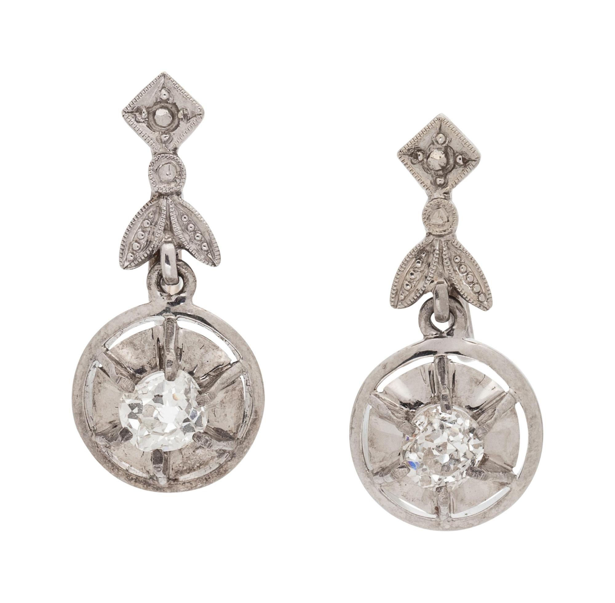 A Pair of White Gold and Diamond Earclips,