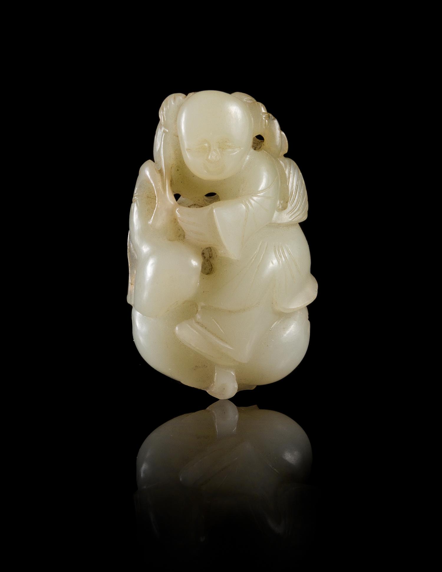 A Near-White Jade Figure of a Boy