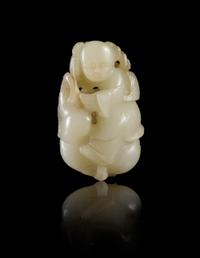 A Near-White Jade Figure of a Boy
