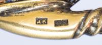 A Russian Silver-Gilt and Enamel Caddy Spoon, Mark of Antip Kuzmichev, Moscow, late 19th century, the handle having polychrome vine ena