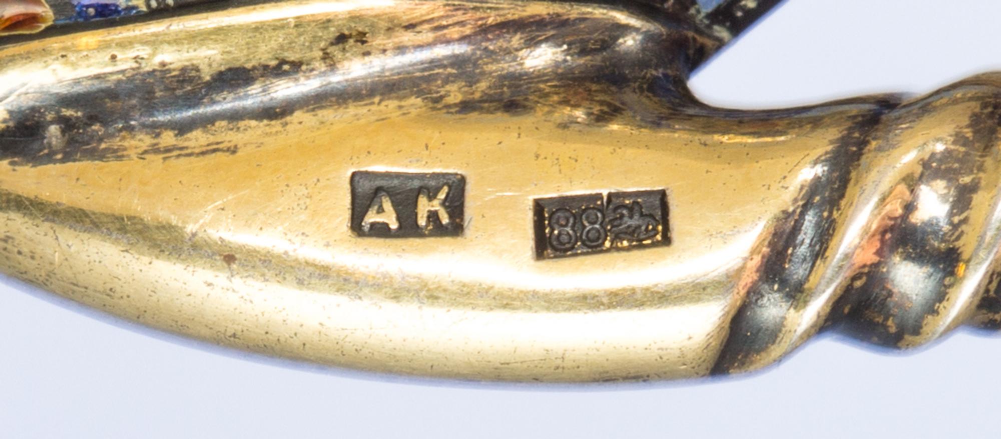A Russian Silver-Gilt and Enamel Caddy Spoon, Mark of Antip Kuzmichev, Moscow, late 19th century, the handle having polychrome vine ena