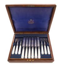 An English Silver-plate Dessert Service, retailed by Mappin & Webb, London, comprising 12 knives and 12 forks, each with mother-of-pear