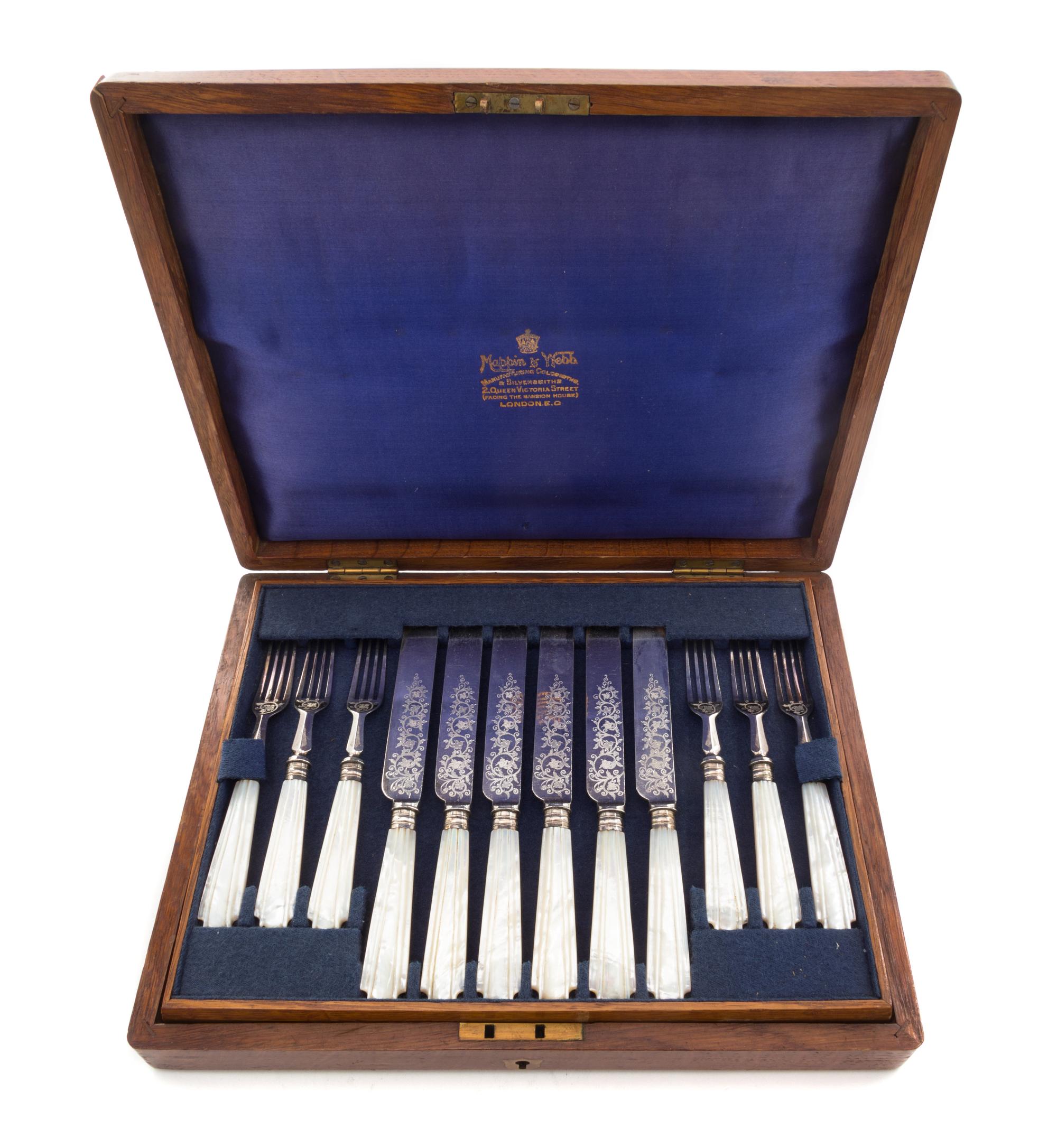 An English Silver-plate Dessert Service, retailed by Mappin & Webb, London, comprising 12 knives and 12 forks, each with mother-of-pear