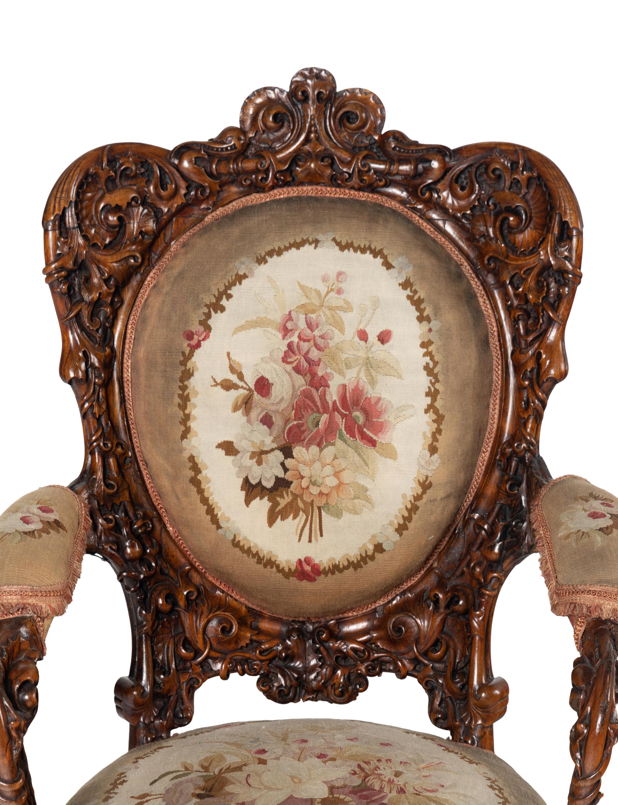 A Pair of Rococo Revival Carved Rosewood Armchairs