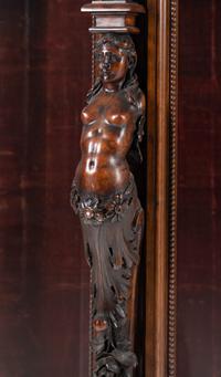 An Italian Renaissance Revival Carved Walnut Cabinet