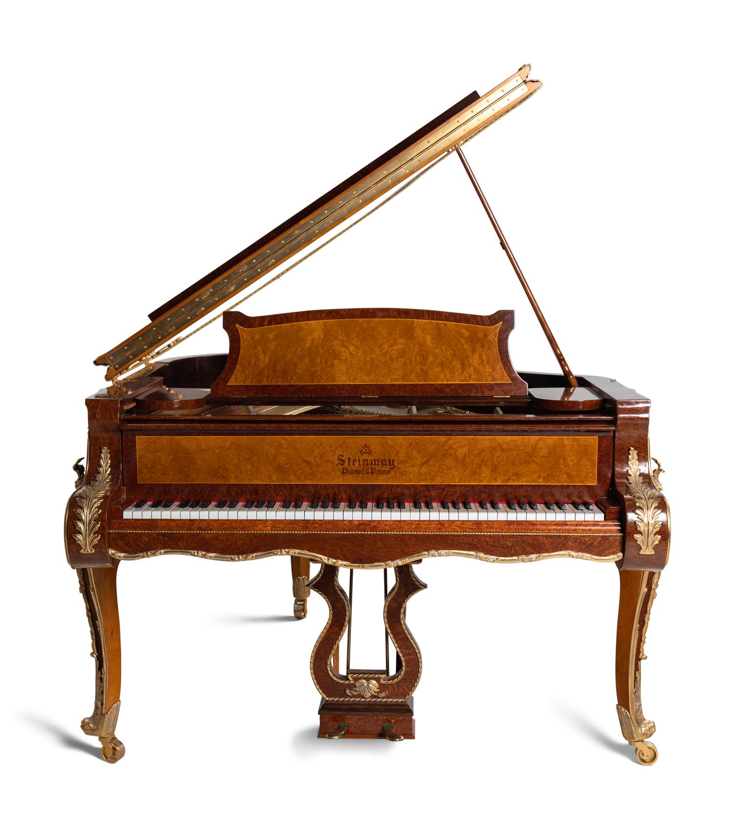 A Louis XV Style Gilt Metal Mounted Burlwood Piano