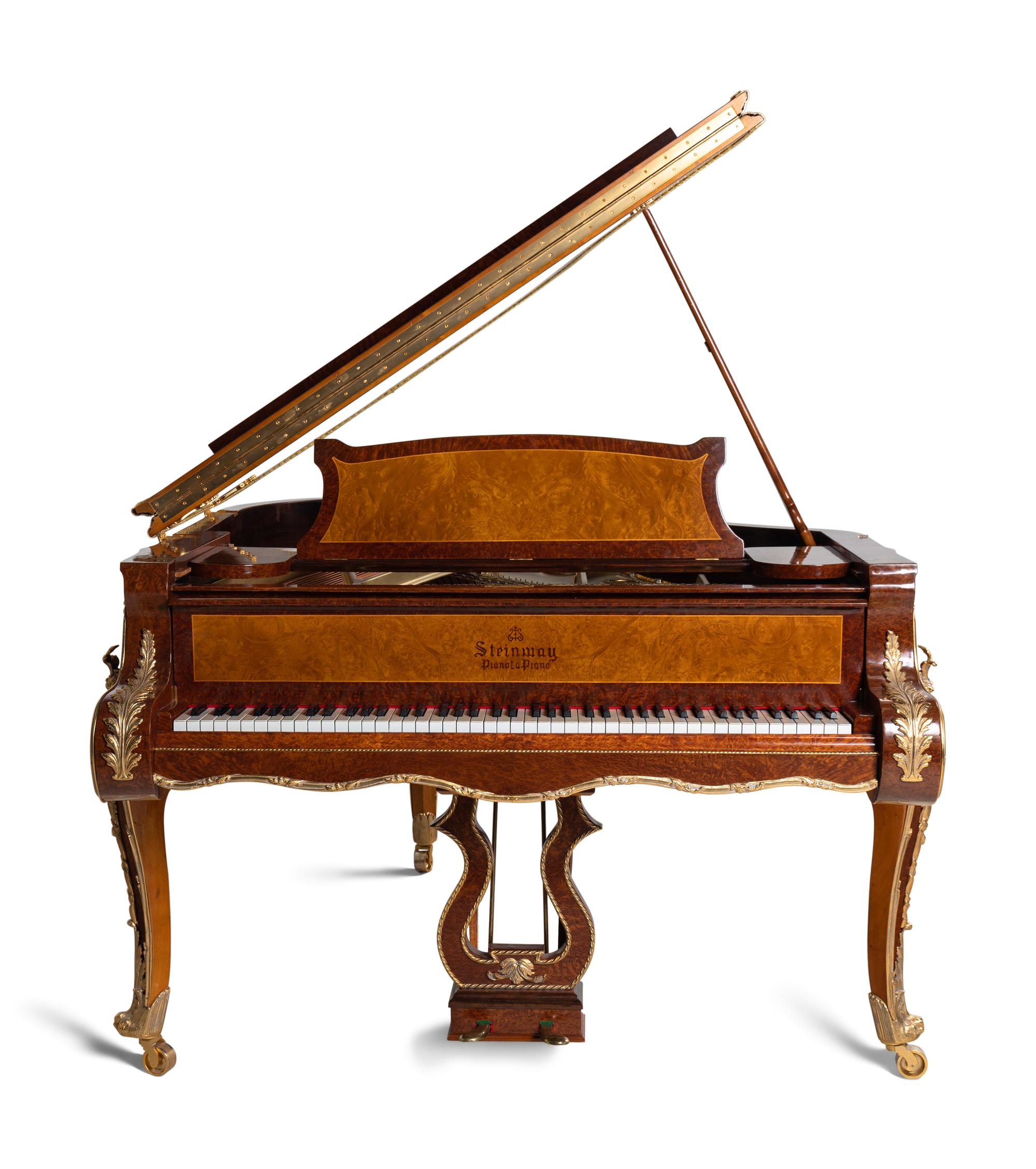 A Louis XV Style Gilt Metal Mounted Burlwood Piano