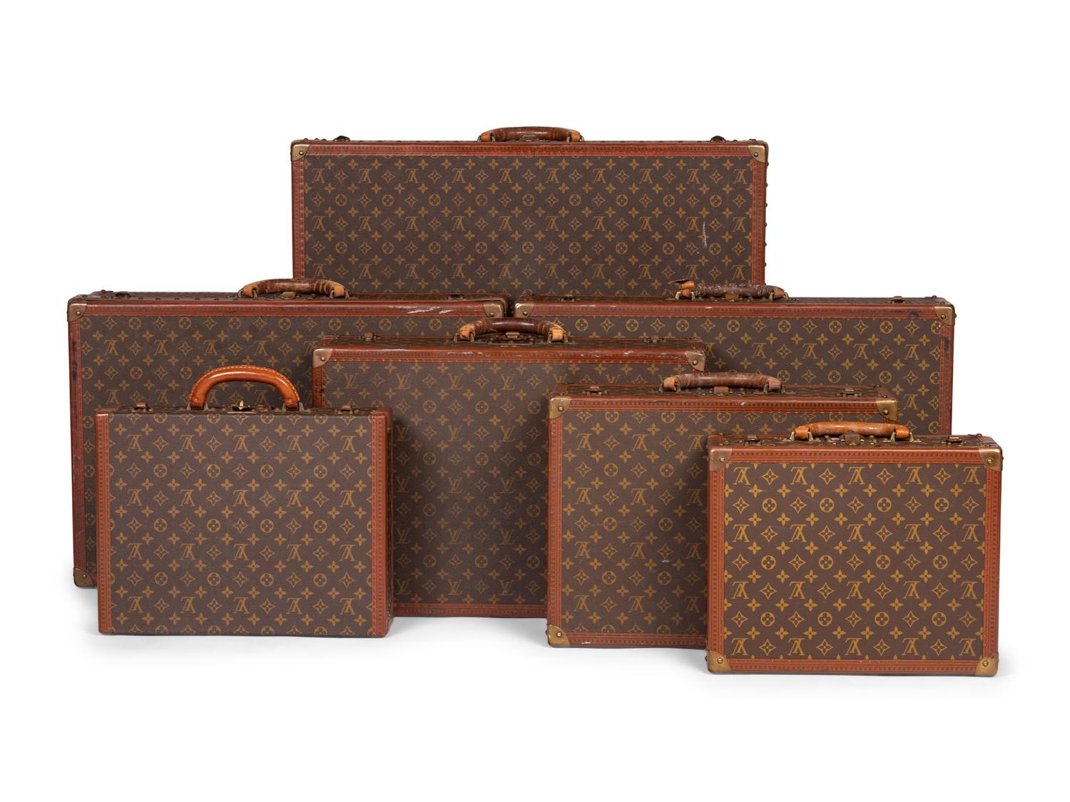 A Group of Seven Louis Vuitton Hardside Suitcases