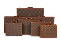 A Group of Seven Louis Vuitton Hardside Suitcases