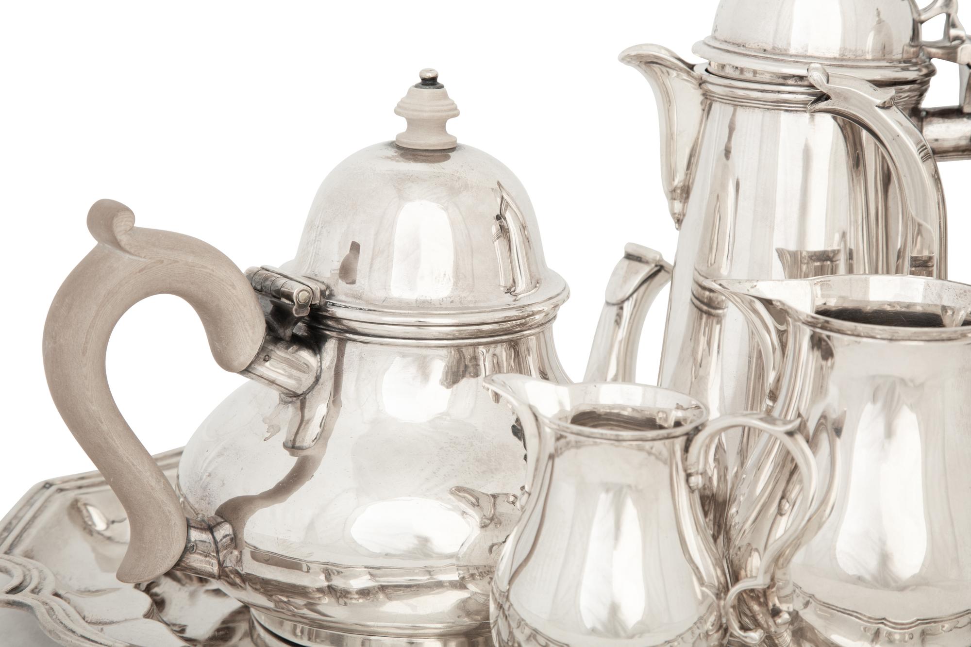 An English Queen Anne Style Silver Five-Piece Tea and Coffee Service