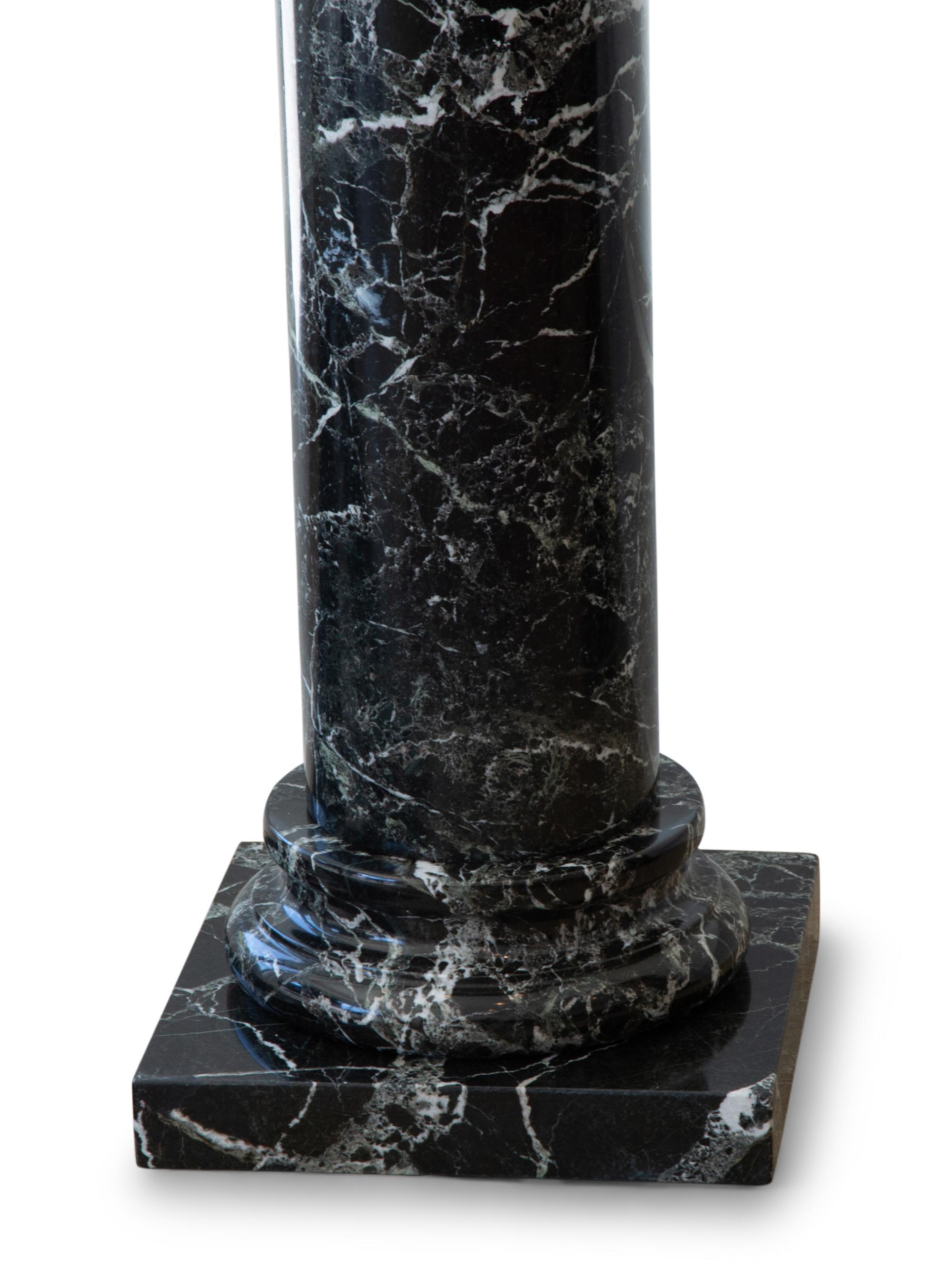 A Pair of Black Marble Pedestals