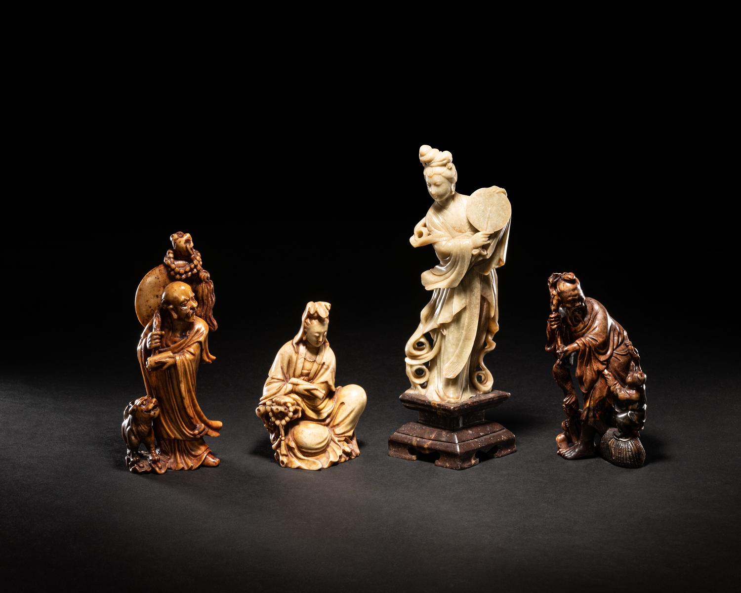 Four Chinese Carved Soapstone Figures of Immortals