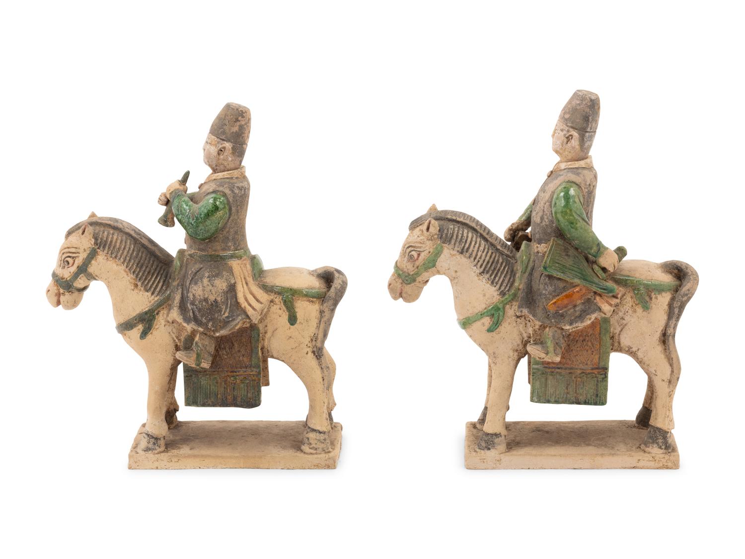 A Pair of Chinese Sancai Glazed Mounted Musician Burial Figures