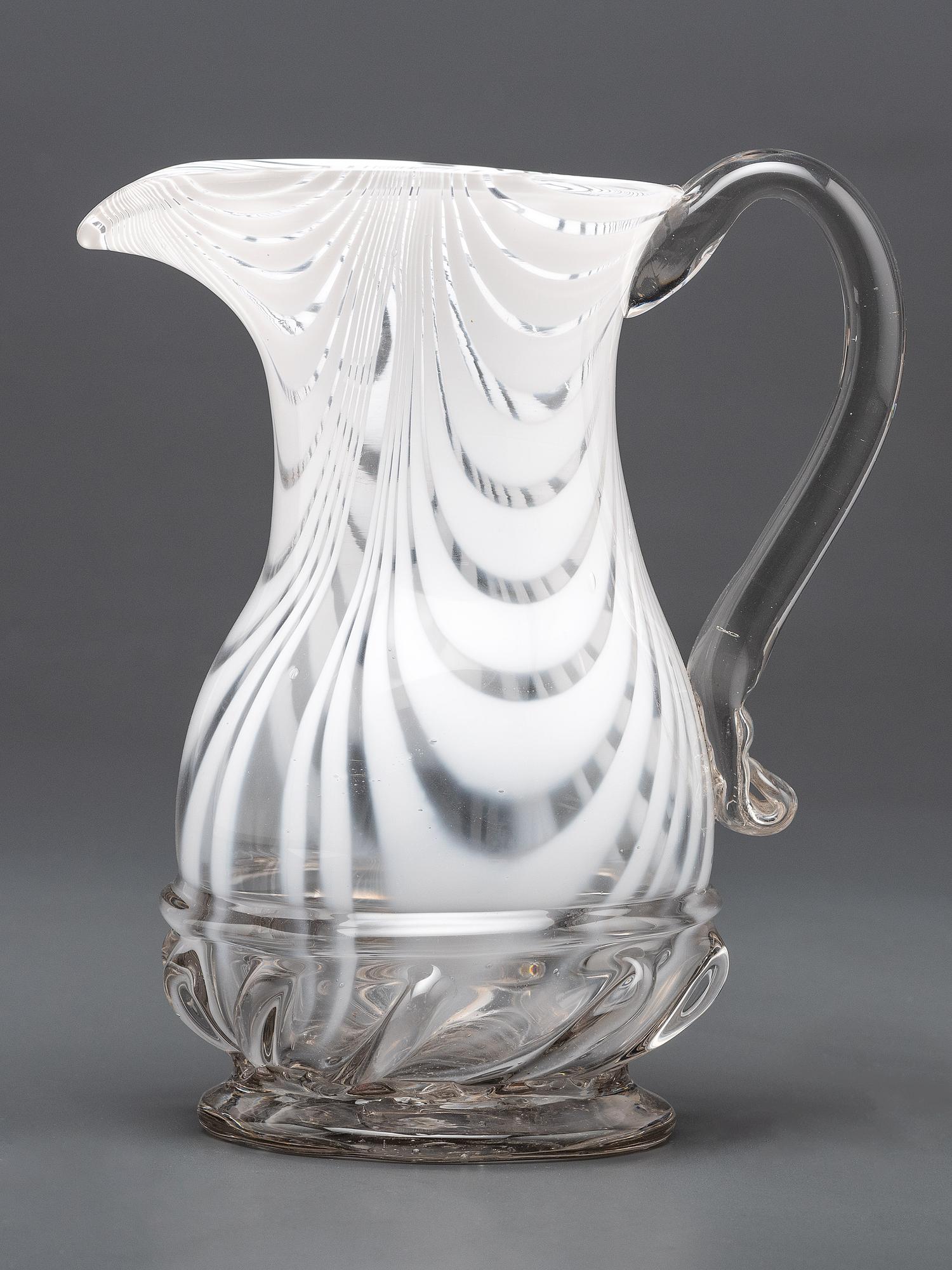 A New Jersey Blown-Glass Pitcher in Clear with White Swirls