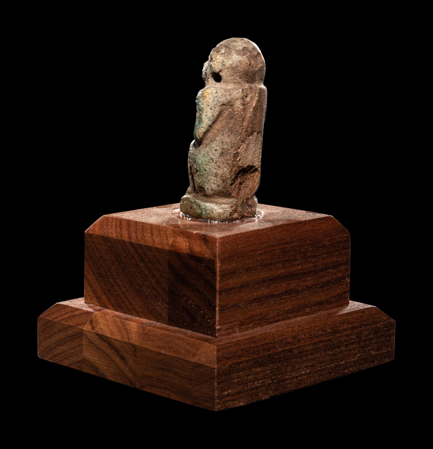 An Egyptian Faience Baboon with Musical Instrument