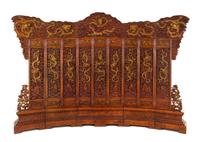 A Large Chinese Export Carved Hardwood 'Dragon and Clouds' Screen