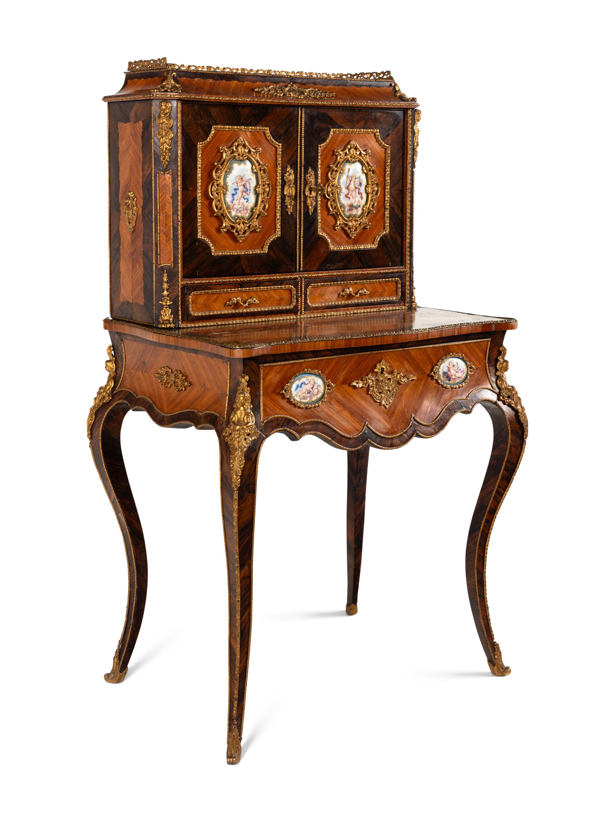 A Napoleon III Gilt Bronze and Porcelain Mounted Kingwood and Rosewood Bonheur du Jour