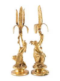A Pair of Figural Gilt Metal Candlesticks