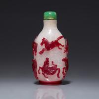 A Chinese Ruby Overlay 'Eight Horses of Wang Mu' Snuff Bottle, 19th Century 清中期 雪霏地套寶石紅料穆王八駿鼻烟壺