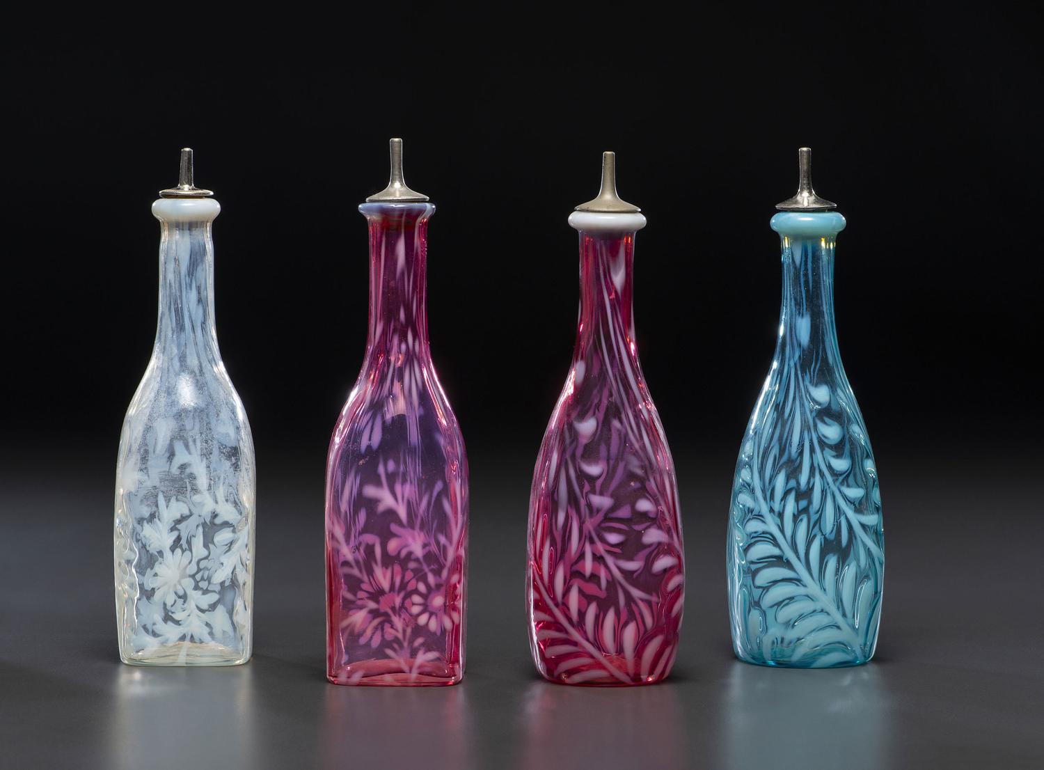 Four Fern Opalescent Glass Barber's Bottles