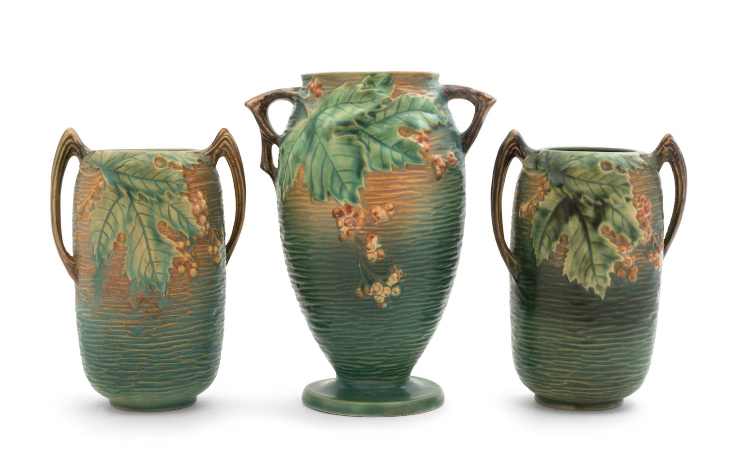 Three Roseville Bushberry Pottery Vases Height of first 9 1/2 inches, pair 8 inches.