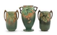 Three Roseville Bushberry Pottery Vases Height of first 9 1/2 inches, pair 8 inches.