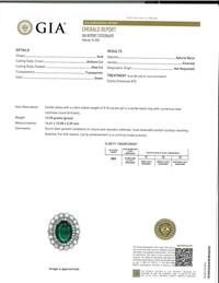An emerald, diamond, and white gold ring
